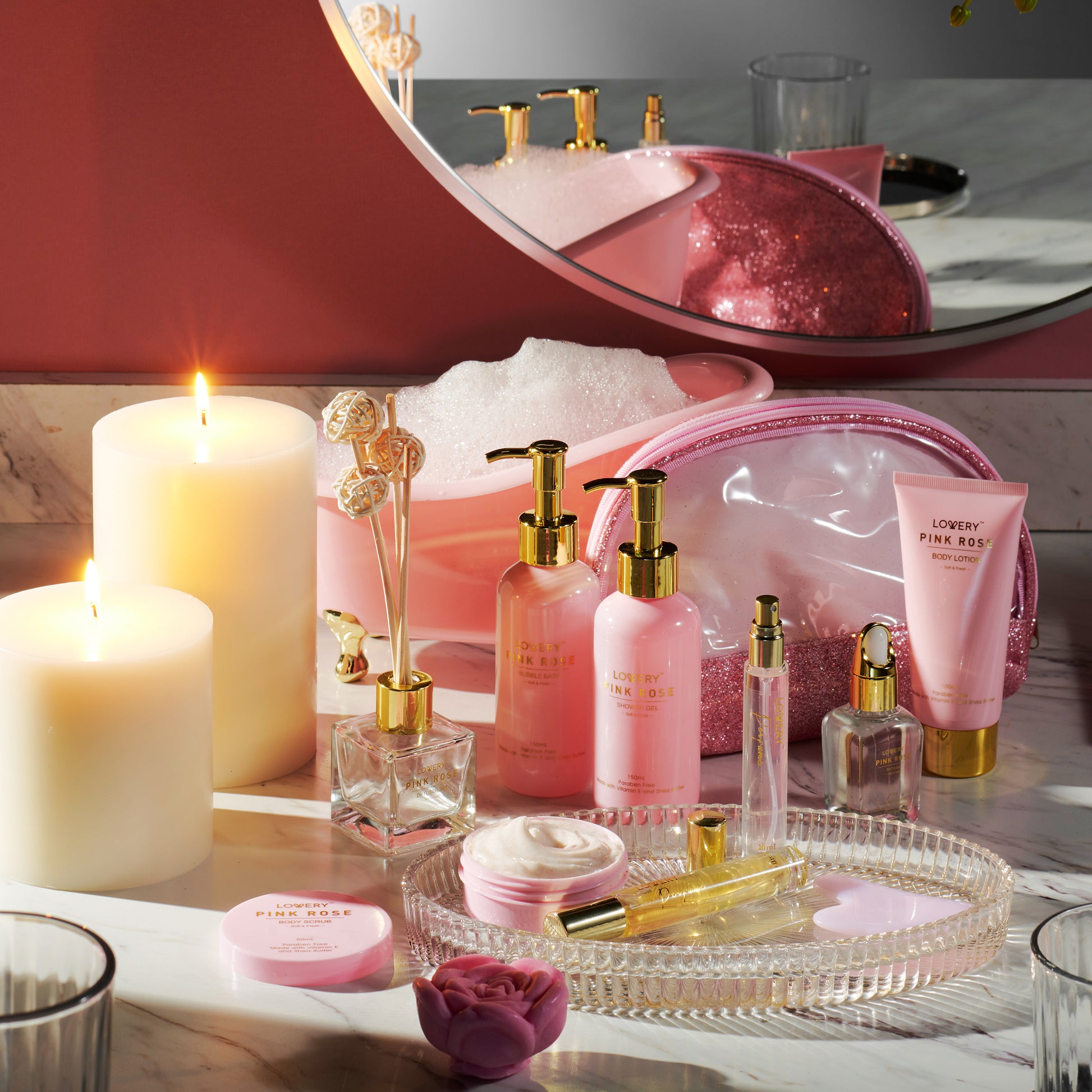 Spa accessories and candles on bathtub filled with foam and rose